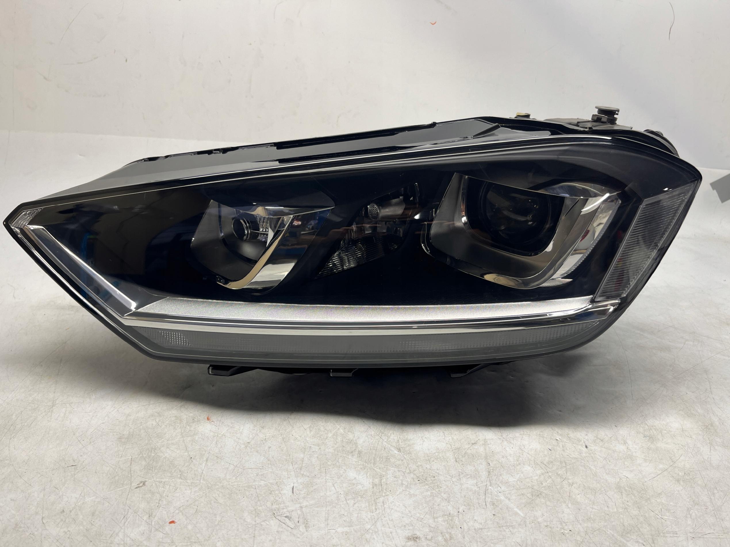 VW GOLF SPORTSVAN REFLEKTOR XENON LAMPA PRZEDNIA LEWA 517941031B