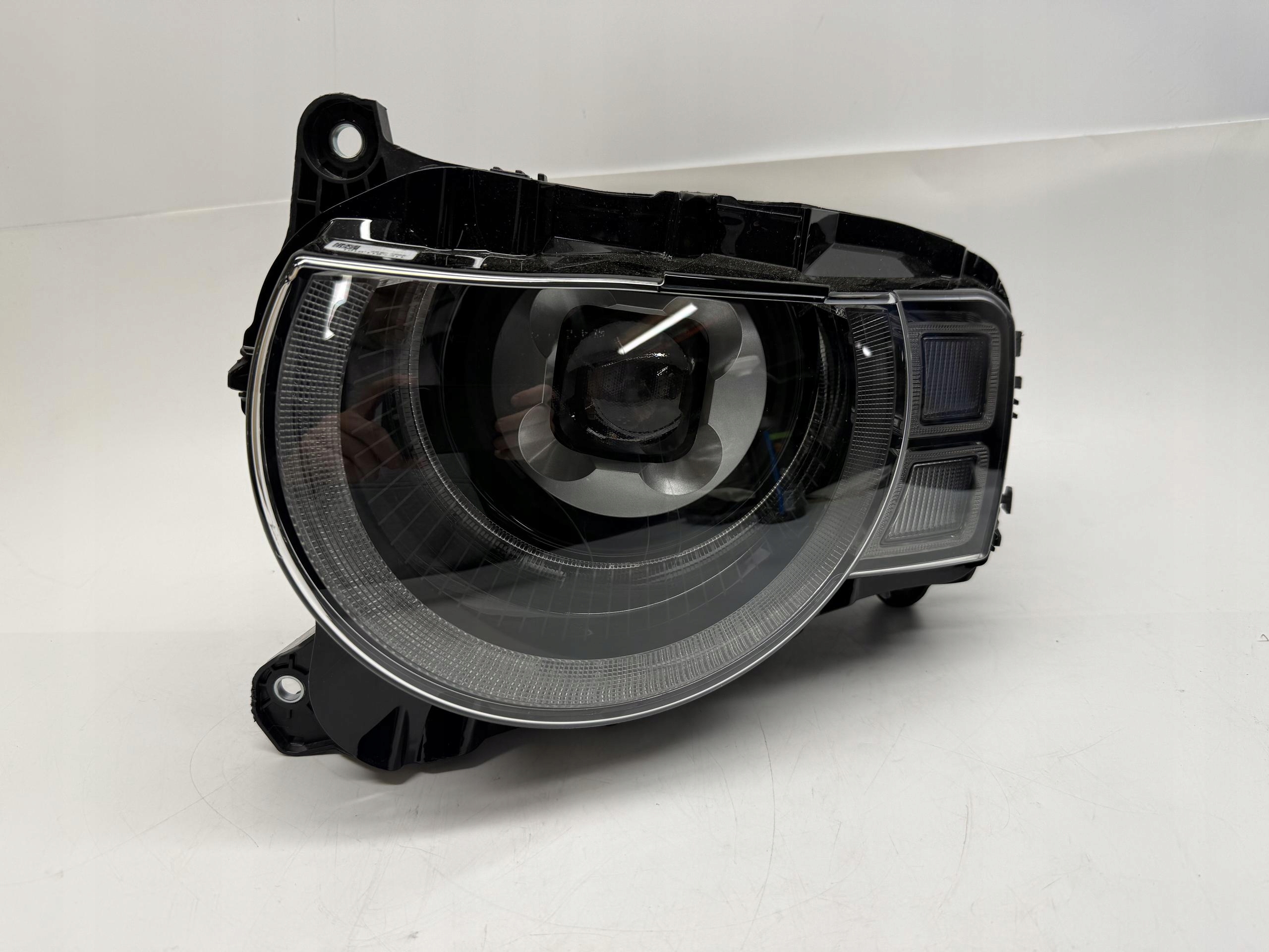 LAND ROVER DEFENDER II L663 REFLEKTOR LAMPA LEWY PRZÓD LED L8B213W030FF